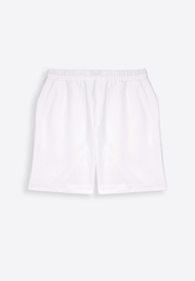 Model wearing classic off-white linen shorts by East Vibe