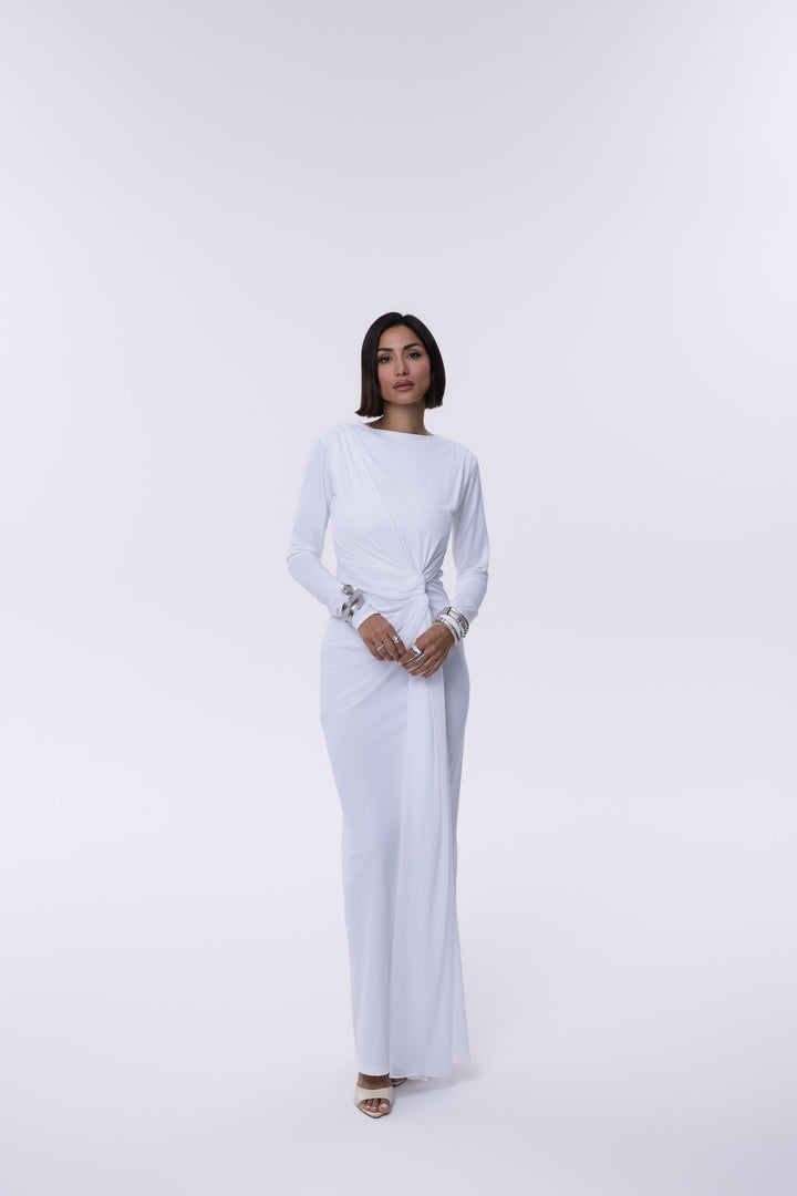 Woman wearing a white long-sleeve dress on a white background