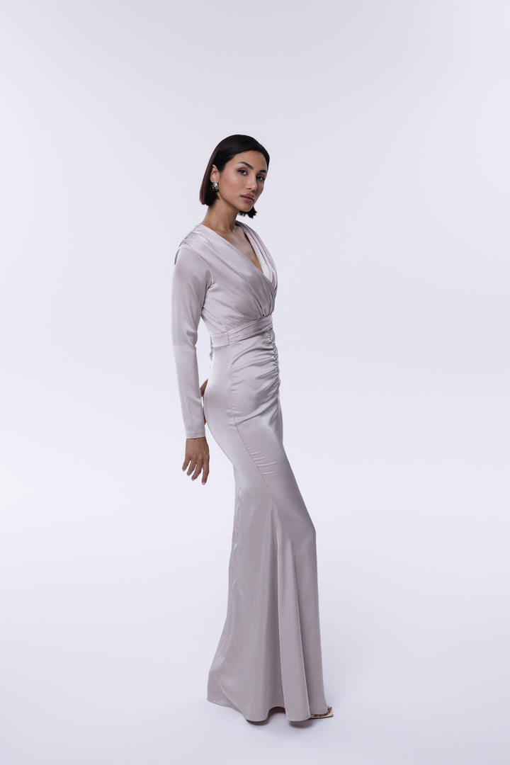 Woman wearing a gray evening gown on a white background