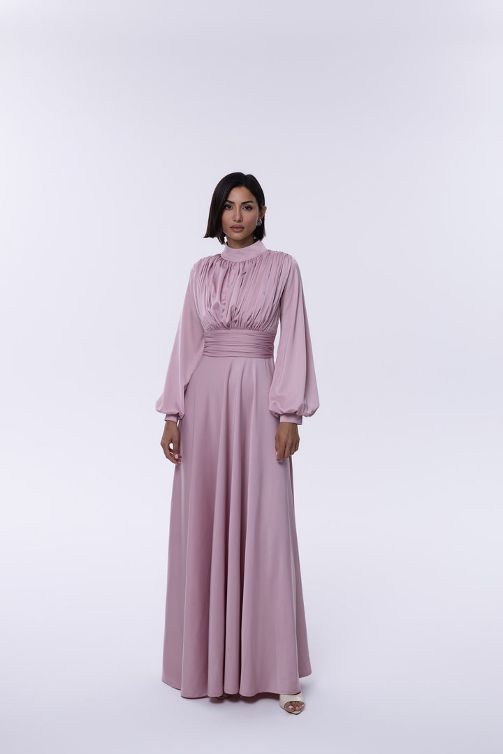 Woman wearing a pink dress on a white background
