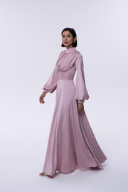 Woman wearing a pink dress on a white background