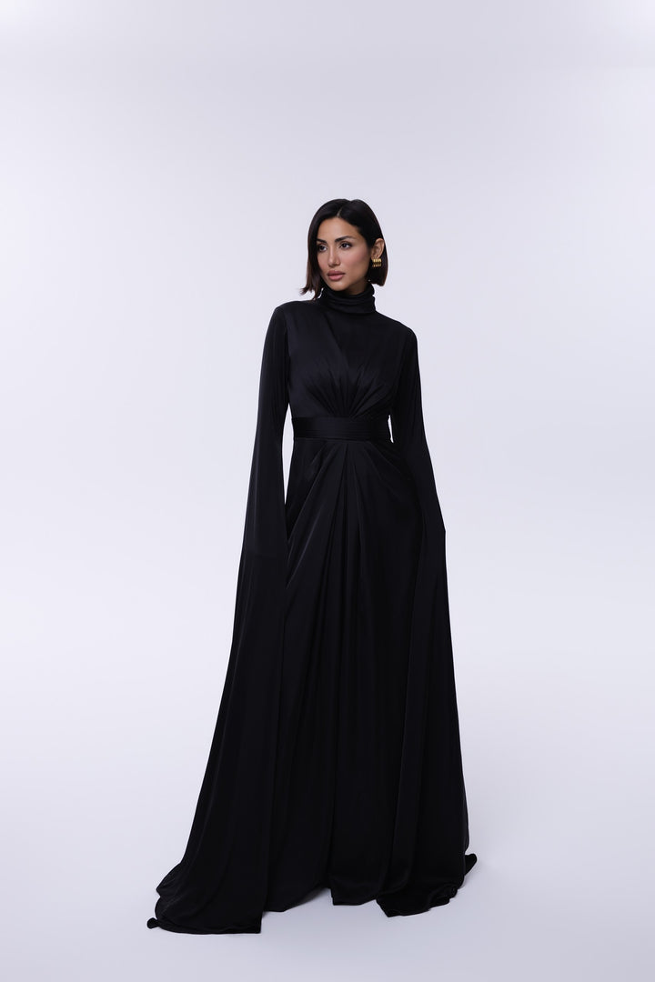 Woman wearing a black evening gown on a white background