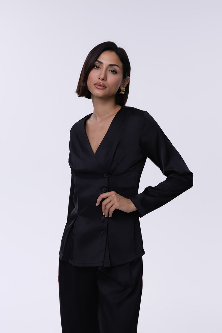 Woman wearing a black suit on a white background