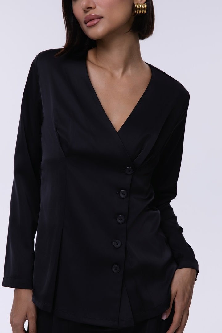 Black blazer worn by a model on a white background