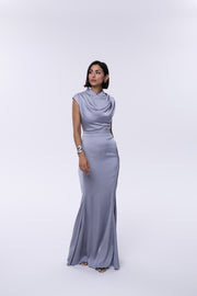Woman wearing a gray evening gown on a white background