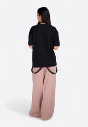 Back view of model wearing Signature Logo Black T-Shirt with visible logo, East Vibe
