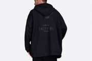 Model wearing black Falcon Edition cotton sweatshirt by East Vibe