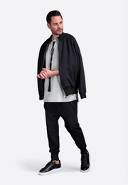 Model wearing black men's sweatshirt by East Vibe