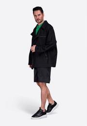 Model wearing black zip-up jacket by East Vibe