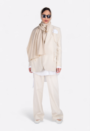 Front view of model wearing EMIRATES LIMITED Beige Long Scarf, East Vibe
