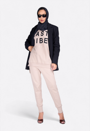 Model wearing long black designer scarf, front-side view – East Vibe
