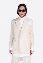 Close-up front view of model wearing EMIRATES LIMITED Cotton Notch Lapel Blazer, East Vibe
