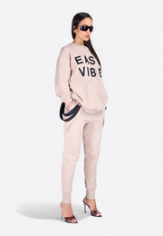 Model wearing crewneck long-sleeve printed T-shirt, front-side view – East Vibe
