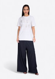 Front view of relaxed waist black trousers on model, East Vibe