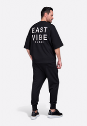 Model wearing EV Signature t-shirt with tassel by East Vibe