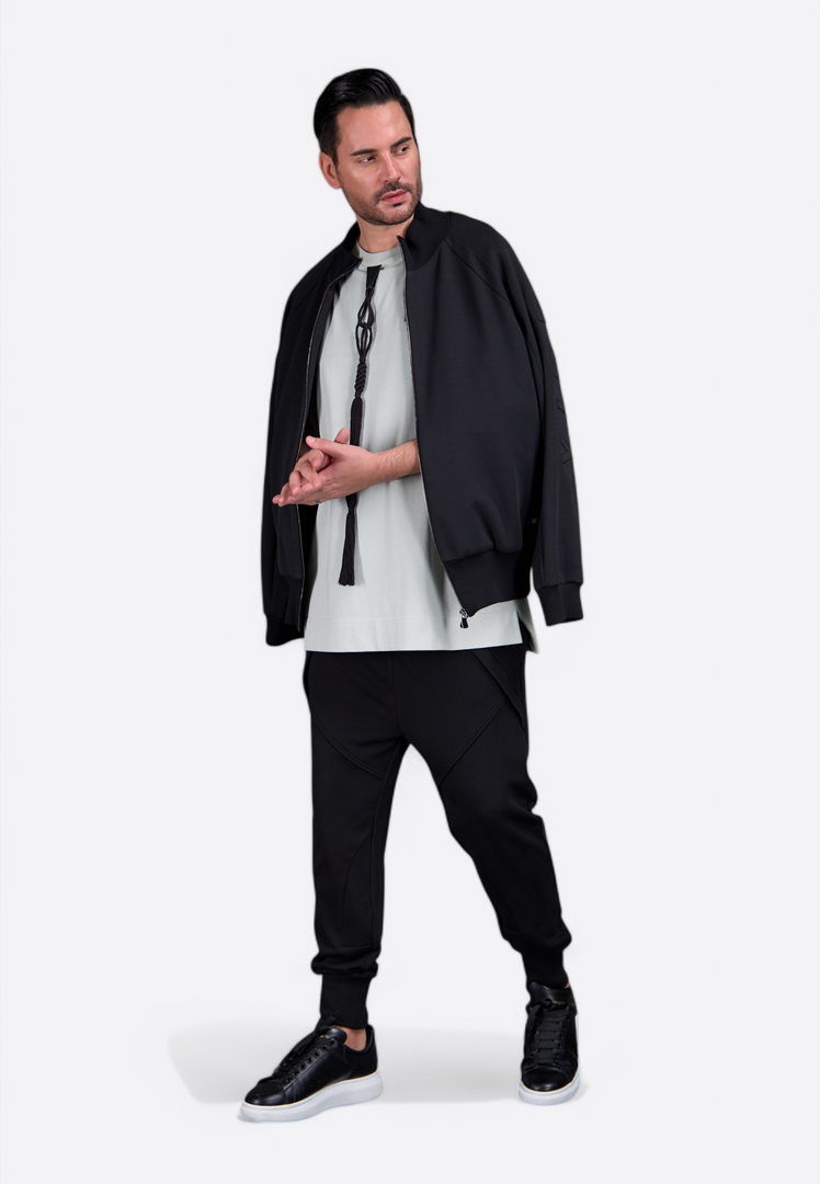 Model showcasing men's black sweatshirt by East Vibe