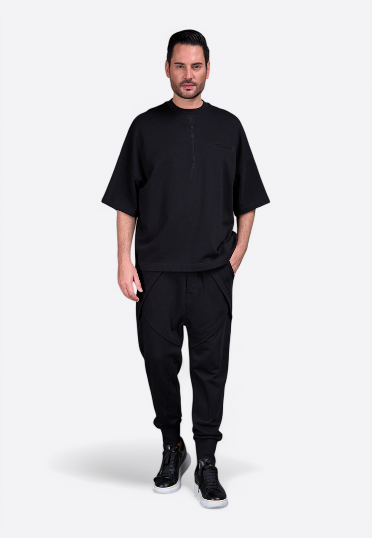 Model in stylish tassel-accented t-shirt by East Vibe