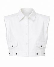 White sleeveless shirt with black button details on a white background