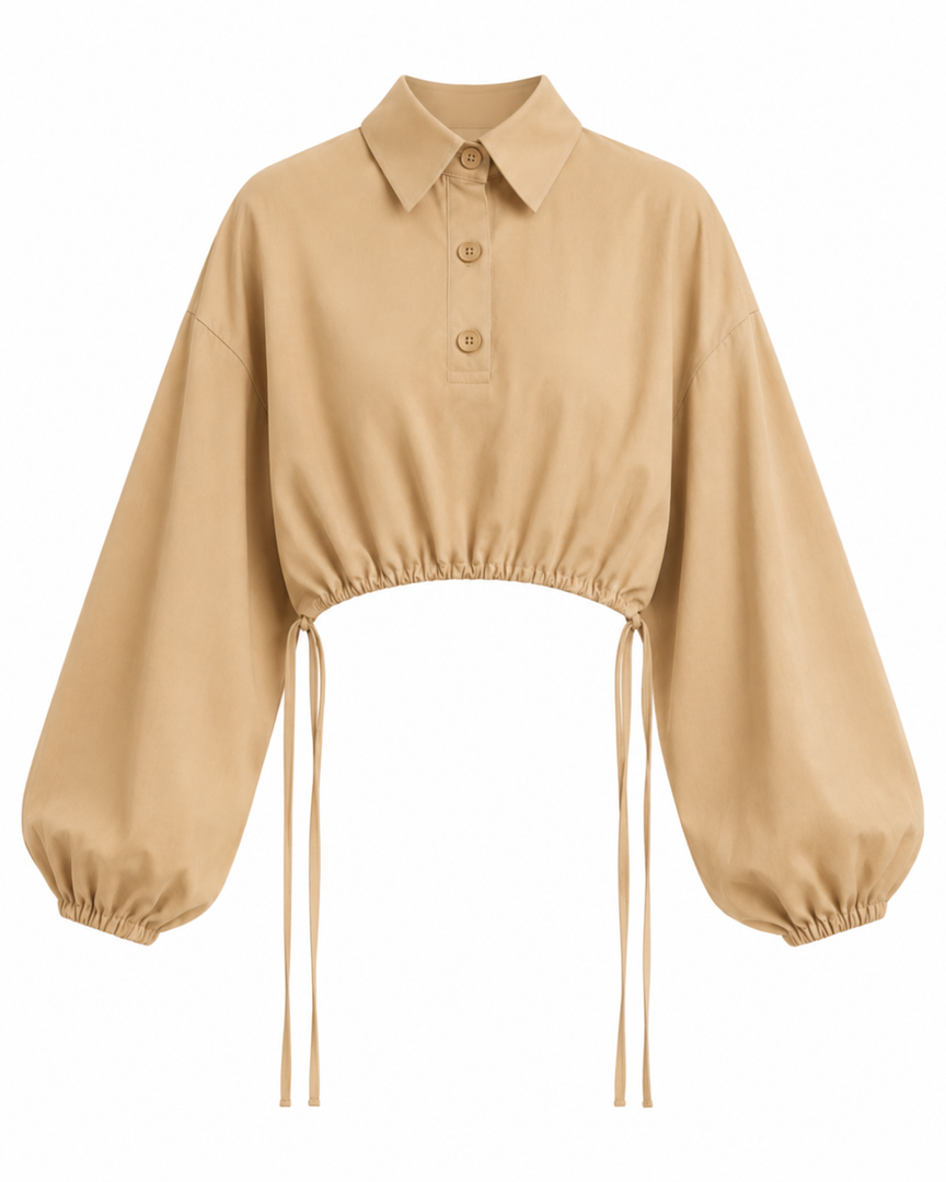 Beige blouse with balloon sleeves on a white background