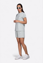 Model wearing high waist green shorts, front view – East Vibe

