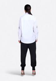 Logo-embossed off-white shirt, back view – East Vibe
