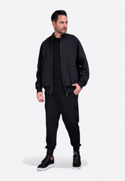 Model wearing EV Signature black zip-up sweatshirt by East Vibe