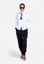 Model wearing classic shirt with decorative tassel, front-side view – East Vibe
