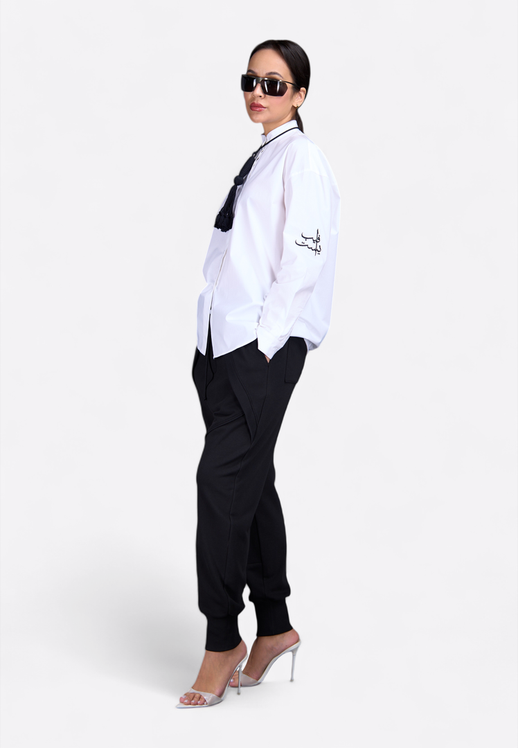 Close-up of classic shirt with decorative tassel, side view – East Vibe
