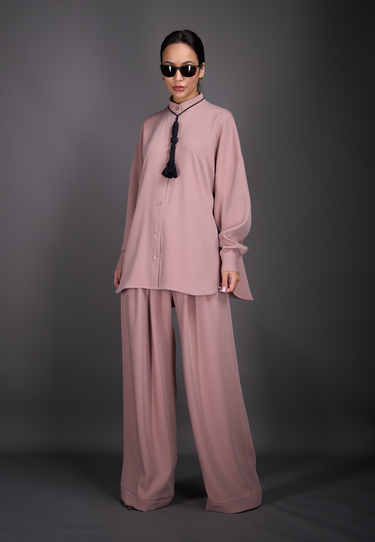 Model wearing silk shirt, pants, and tessel, front-side view – East Vibe
