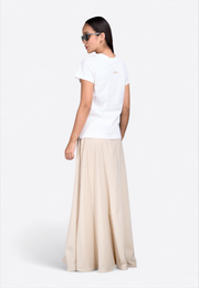 Model wearing beige long cotton skirt by East Vibe