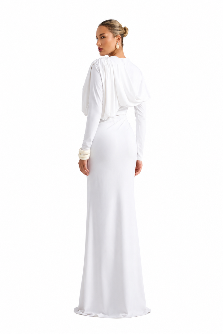 Woman wearing a white evening gown on a white background