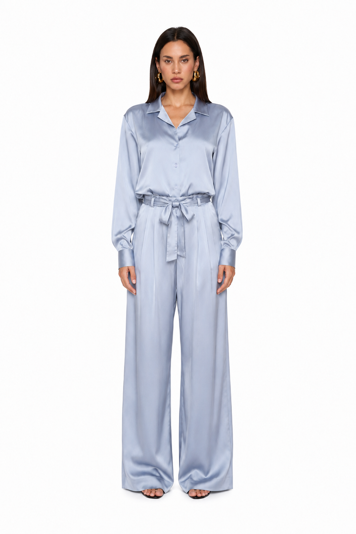 Woman wearing Elara silver blue satin shirt co-ord set by East Vibe
