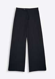 Close-up of relaxed waist black trousers on plain background, East Vibe

