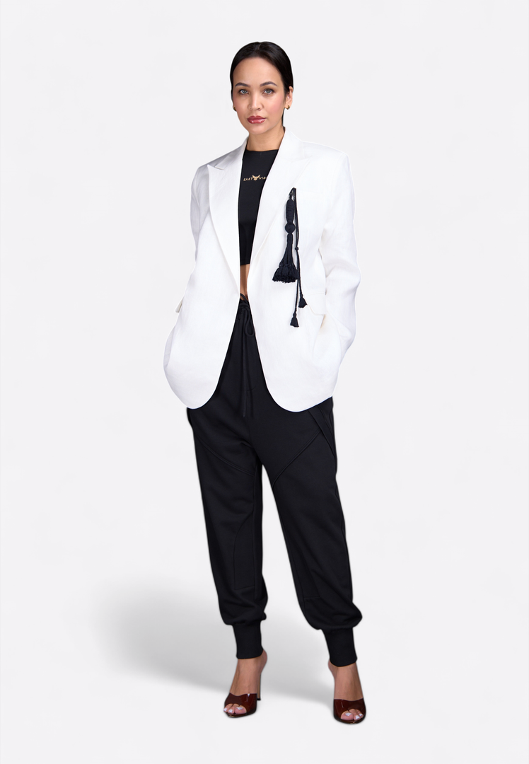 Model wearing white blazer with tassel detailing, stylish front pose – East Vibe
