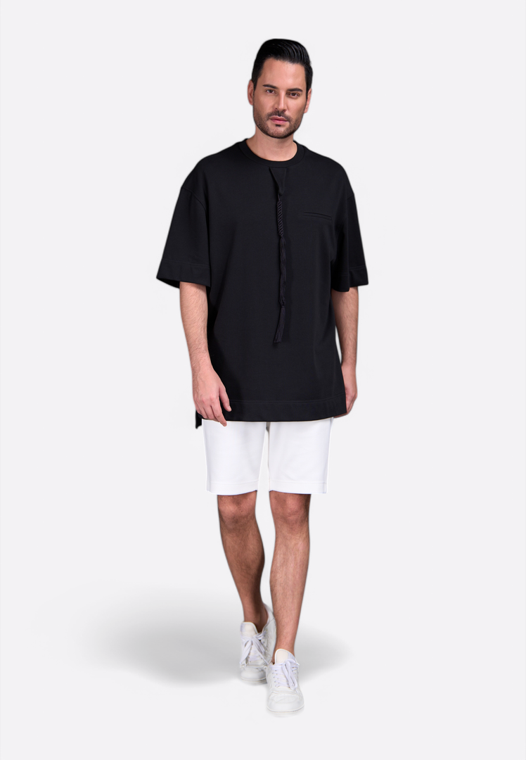 Man wearing white cotton shorts with elastic waistband and side pockets by East Vibe