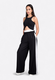 Model wearing White wide-leg striped trousers, tailored fit, East Vibe

