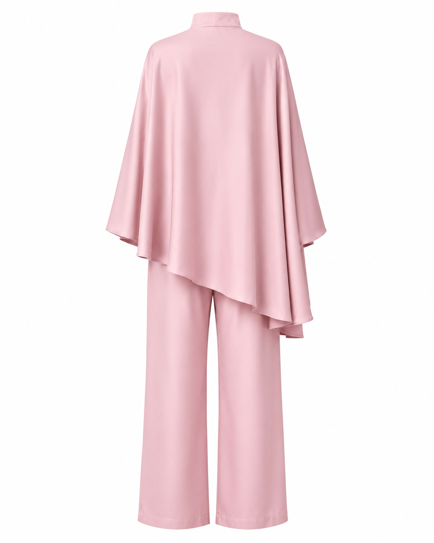 Pink outfit with a cape-like top and wide-leg pants on a white background