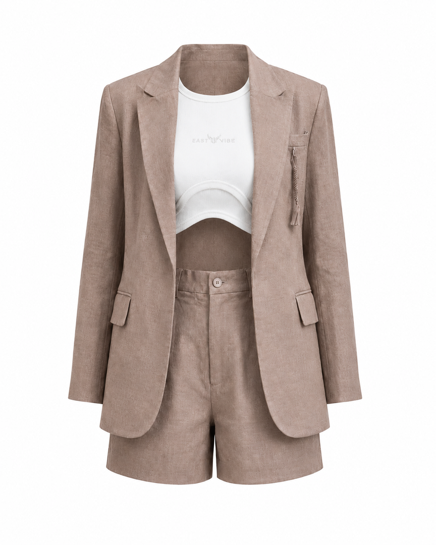 Beige blazer, white crop top, and beige shorts on a white background