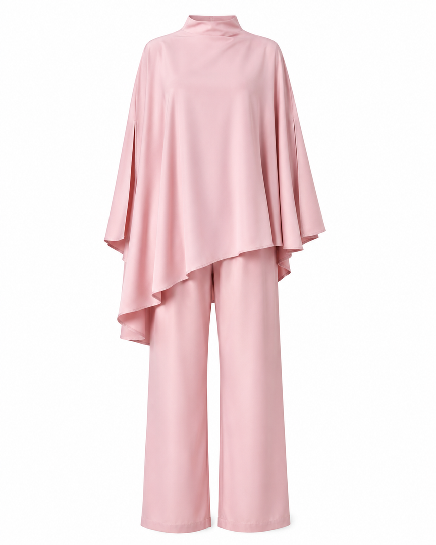 Pink outfit with a cape-like top and wide-leg pants on a white background