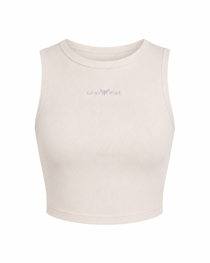 Beige crop top with 'Carhartt' branding on a white background