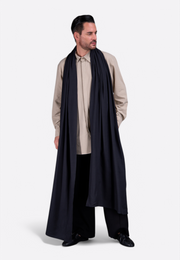 Model wearing long black cotton scarf by East Vibe