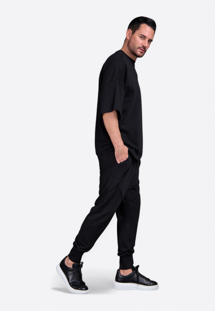 Men's oversized black t-shirt, back view, by East Vibe